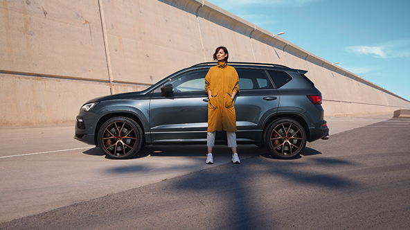 woman standing next to cupra ateca 2020 rodium grey colour